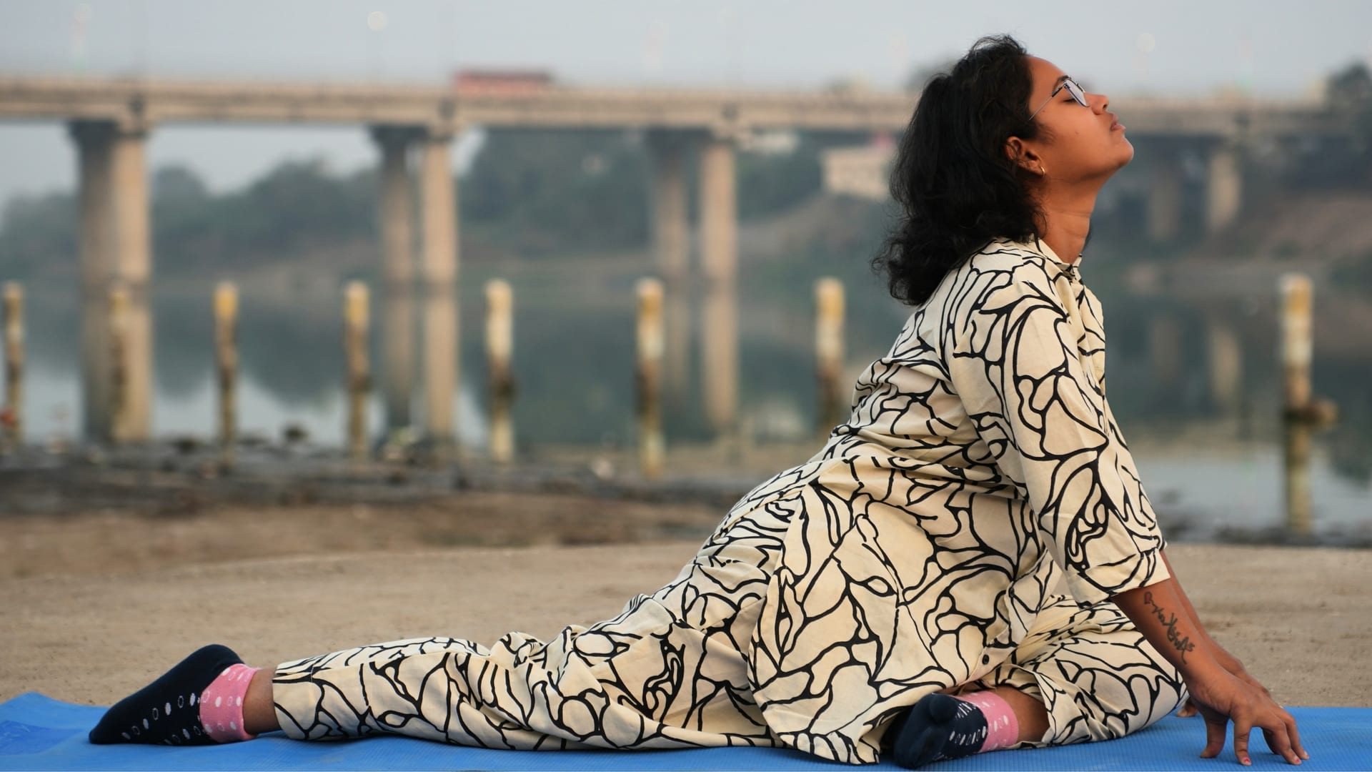 Priyanka Goje performing yoga by the river